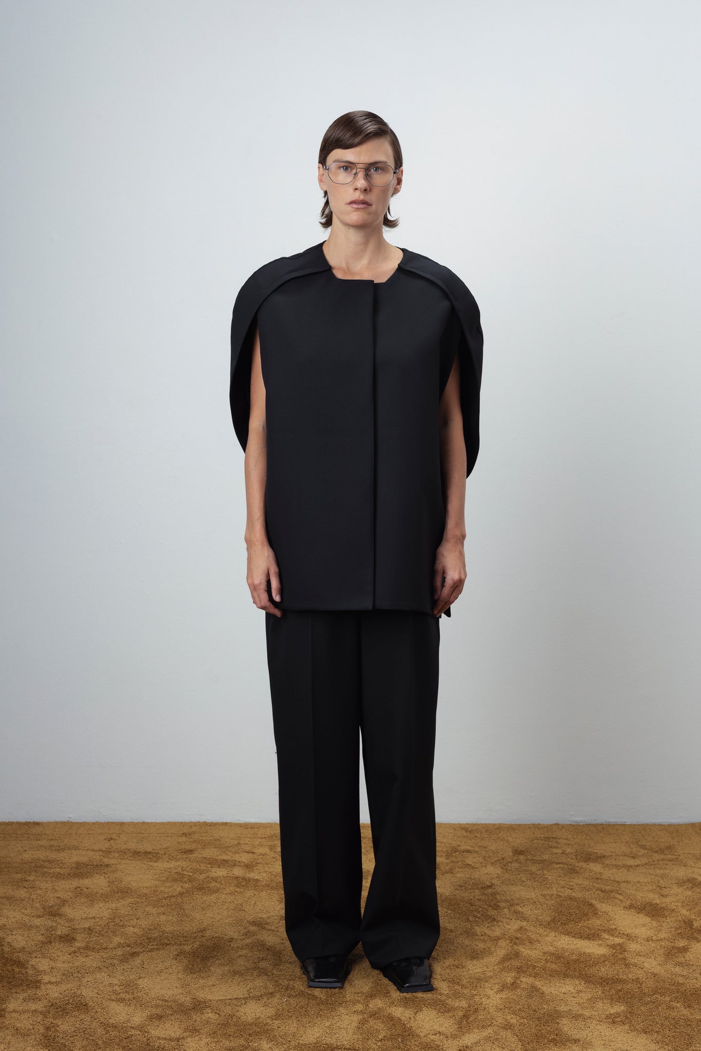 SCULPTURAL WOOL CAPE IN BLACK